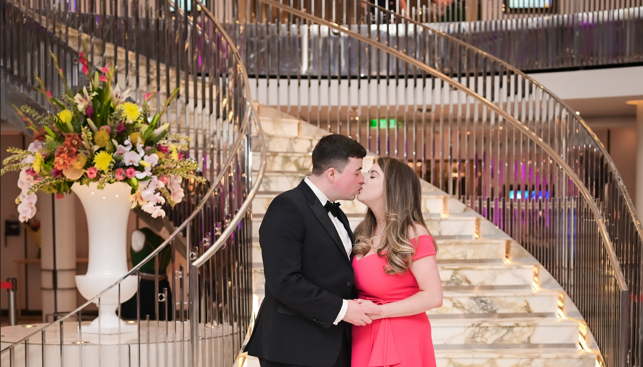 Lauren and Josh together beside a staircase